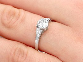 platinum diamond engagement ring on finger
