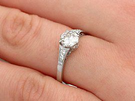platinum round diamond engagement ring on finger