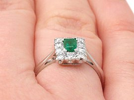 vintage emerald and diamond cocktail ring on finger