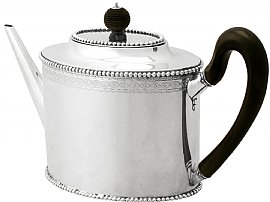 silver teapot back view