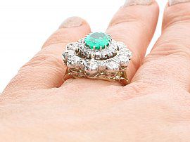 large emerald ring on hand
