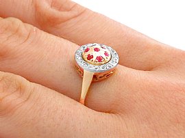 ruby and gold ring on finger