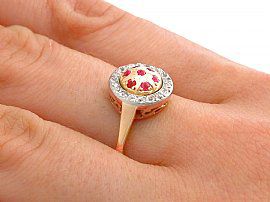 ruby and gold ring on finger