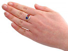 spinel and sapphire ring on hand