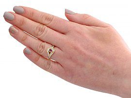 wearing gold ruby ring