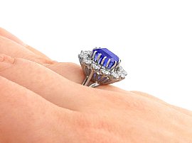 Blue Sapphire and Diamond Cluster Ring on fInger