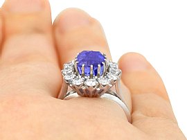 wearing a Blue Sapphire and Diamond Cluster Ring for Sale