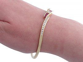 Ruby and Diamond Yellow Gold Bangle being worn