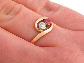 gold ruby twist ring on finger