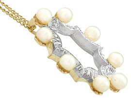 Pearl and diamond pendant yellow gold