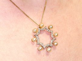 wearing Pearl and diamond pendant yellow gold