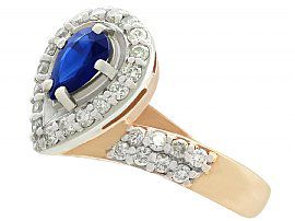 pear cut sapphire ring with diamonds in yellow gold