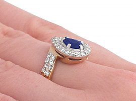 gold pear cut sapphire ring on hand