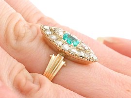 Wearing Emerald and Diamond Ring on hand