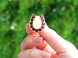 Gold Horseshoe Cufflinks with Garnets for Sale Outside