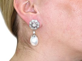 Wearing Large Pearl and Diamond Drop Earrings 