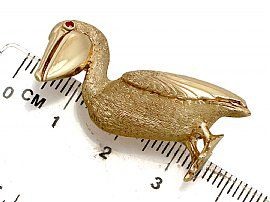 gold bird brooch size