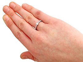 diamond ring with diamond shoulders on hand
