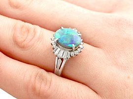 Opal and Diamond Cluster Ring in Platinum on the Hand