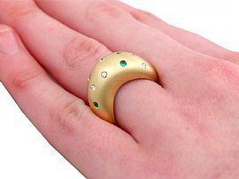 Gold Ring with Gemstones on Hand