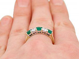 Five Stone Emerald and Diamond Ring on Finger