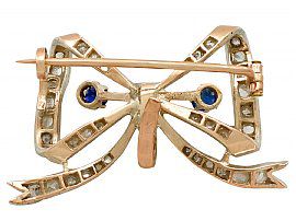 Antique Bow Brooch with Sapphires and Diamonds in Yellow Gold