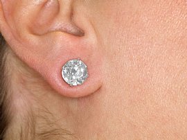 wearing 6 carat stud earrings  