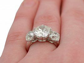 wearing a Diamond trilogy Ring in White Gold 