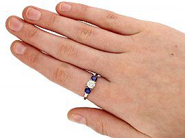 Sapphire and Diamond Trilogy Ring on hand