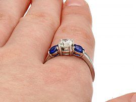 wearing a sapphire trilogy ring