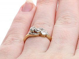 Three Stone Diamond Twist Ring Wearing Finger