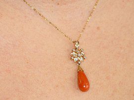 Yellow Gold and Coral Pendant Wearing Neck