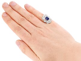 Cabochon sapphire and diamond ring on the hand