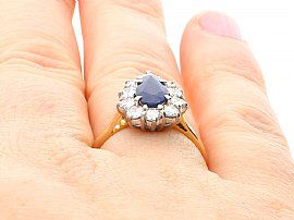 Pear Cut Sapphire Cluster Ring on finger