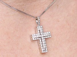 diamond cross pendant on neck