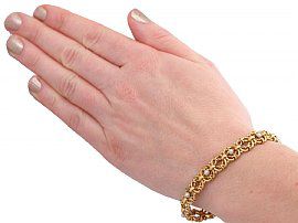 wearing Victorian Pearl Bracelet in Gold 
