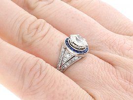 Antique Diamond Ring with Sapphire Halo on finger