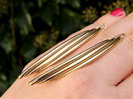 Gold Cartier Hair Clips outside
