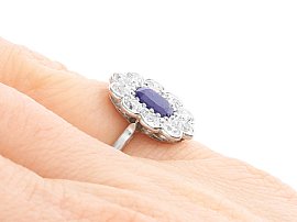 Wearing Cushion Cut Sapphire and Diamond Ring