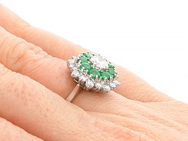 White Gold Emerald Diamond Cluster Ring on finger