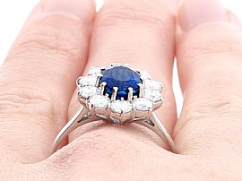 Oval Sapphire and Diamond Ring on Finger