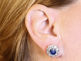 Wearing Sapphire and Diamond Cluster Earrings
