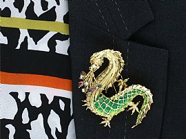 Gold Dragon Brooch with Gemstones Wearing 