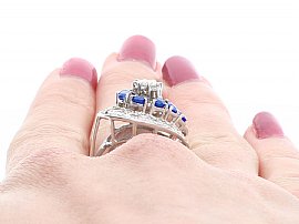 Sapphire and Diamond Cluster Ring Being Worn