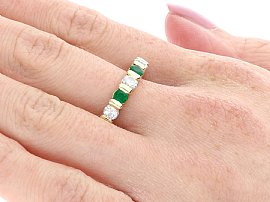 wearing emerald and diamond eternity ring