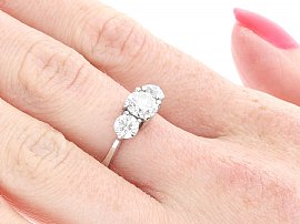 Round Brilliant Cut Diamond Trilogy Ring on hand
