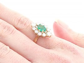 Vintage Emerald and Diamond Cluster Ring Wearing Side On 