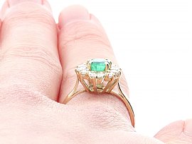 Vintage Emerald and Diamond Cluster Ring Wearing Close Up 
