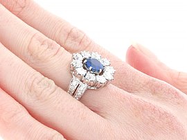 Vintage Sapphire and Diamond Cluster Ring Platinum Wearing Side On 
