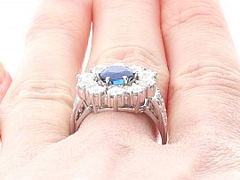 Vintage Sapphire and Diamond Cluster Ring Platinum Wearing Close Up 